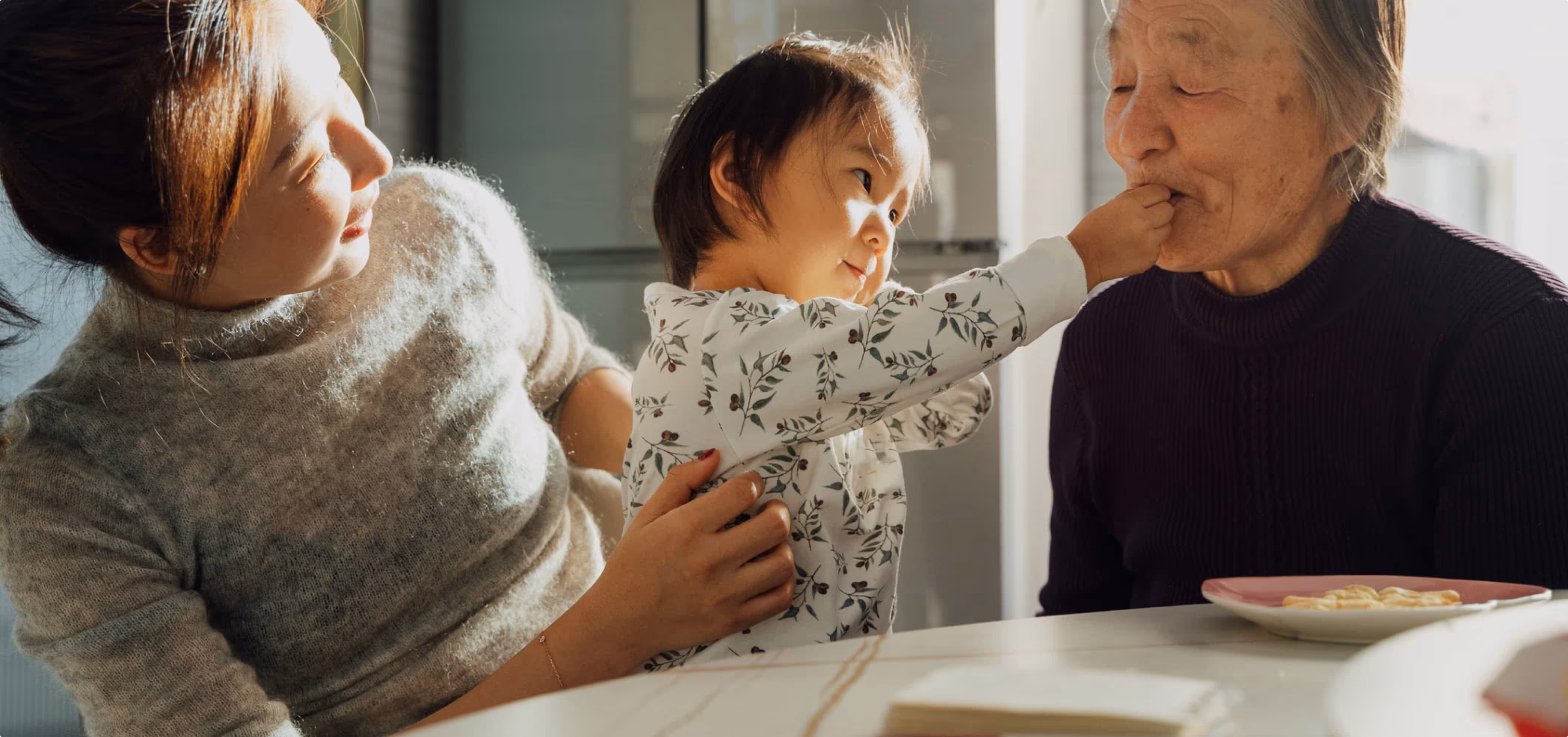 child with her grandmother and mother