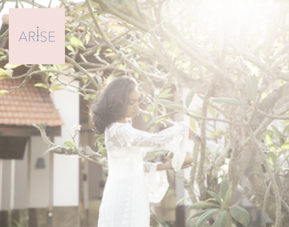 woman in a garden with arise logo